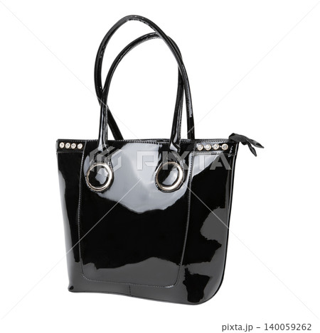 Beige patent leather shopper bag with glossy finish isolated on white background. Elegant female tote handbag with back zipper pocket and long handles. 140059262