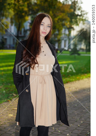 Beautiful brunette wearing a dress Beautiful brunette wearing a dress 140059353