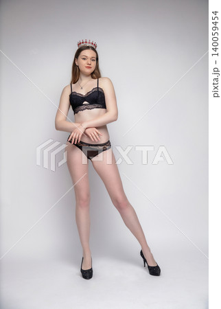 Young lovely brunette dressed in lingerie Young lovely brunette dressed in lingerie 140059454