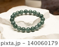 Natural stone bracelet made from Burmese Jade on white stone 140060179