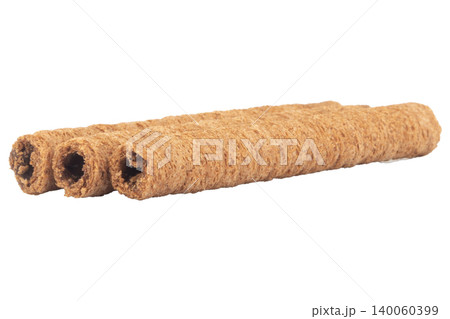 Chocolate cylinder rolled dark isolated on white background Chocolate cylinder rolled dark isolated on white background 140060399