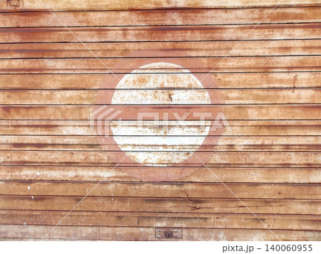 Faded circular logo on weathered wood. Faded circular logo on weathered wood. 140060955