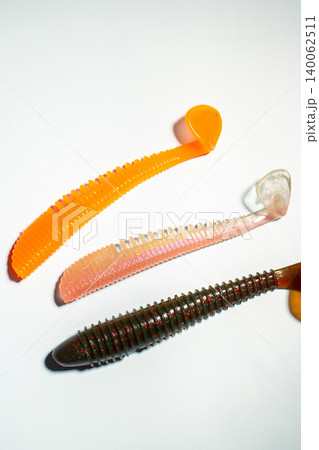 Fishing custom worms. Fishing hobby concept. Accessories on white background Fishing custom worms. Fishing hobby concept. Accessories on white background 140062511