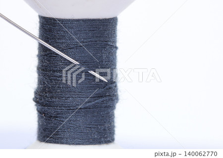 Close up needle and thread  on white background 140062770