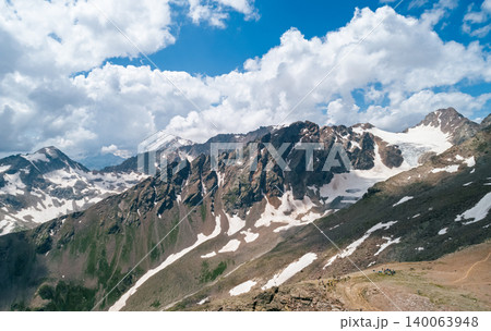 Majestic mountain range with snow and a glacier under a blue sky 140063948