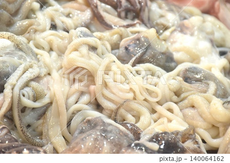 raw squid ingredient food topping ice for fresh keeping on refrigerator displays at supermarket raw squid ingredient food topping ice for fresh keeping on refrigerator displays at supermarket 140064162