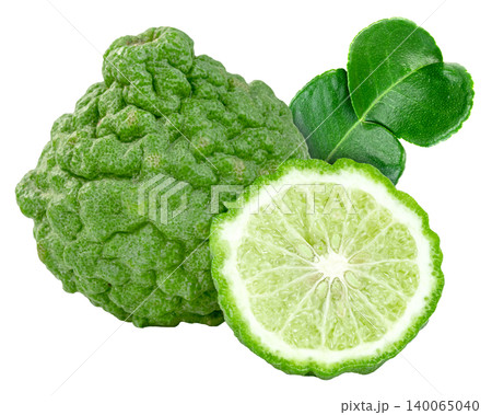 Fresh kaffir lime fruit and a half slice with green leaves isolated. Citrus hystrix with wrinkled skin, often used for Thai food, essential oils, and aromatherapy products. Fresh kaffir lime fruit and a half slice with green leaves isolated. Citrus hystrix with wrinkled skin, often used for Thai food, essential oils, and aromatherapy products. 140065040