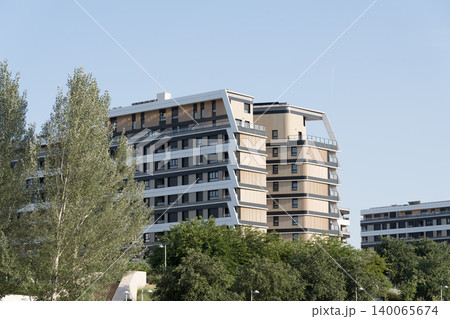 Modern residential buildings surrounded by urban greenery Modern residential buildings surrounded by urban greenery 140065674