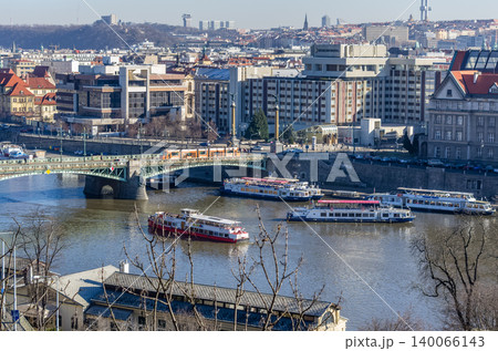 Vltava River panorama with tram crossing Legion Bridge and tour boats in winter, Prague, Czech Republic Vltava River panorama with tram crossing Legion Bridge and tour boats in winter, Prague, Czech Republic 140066143