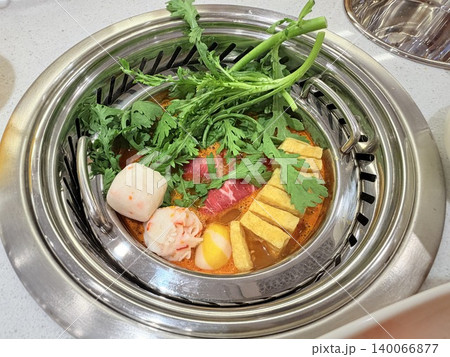 Chinese Hot Pot with Spicy Broth and Fresh Ingredients Chinese Hot Pot with Spicy Broth and Fresh Ingredients 140066877