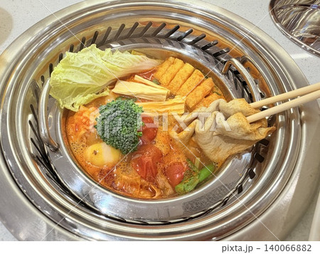 Chinese Hot Pot with Spicy Broth and Fresh Ingredients 140066882