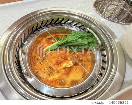 Chinese Hot Pot with Spicy Broth and Fresh Ingredients Chinese Hot Pot with Spicy Broth and Fresh Ingredients 140066891