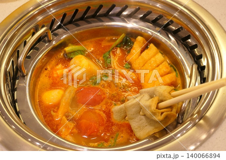 Chinese Hot Pot with Spicy Broth and Fresh Ingredients Chinese Hot Pot with Spicy Broth and Fresh Ingredients 140066894