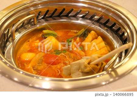 Chinese Hot Pot with Spicy Broth and Fresh Ingredients Chinese Hot Pot with Spicy Broth and Fresh Ingredients 140066895