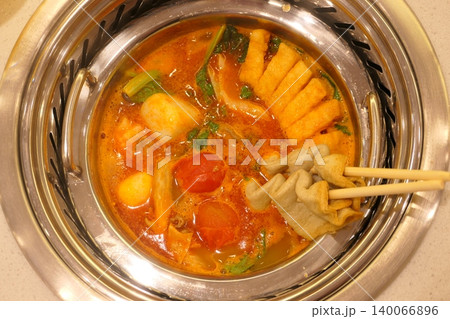 Chinese Hot Pot with Spicy Broth and Fresh Ingredients Chinese Hot Pot with Spicy Broth and Fresh Ingredients 140066896