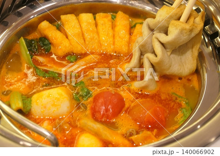 Chinese Hot Pot with Spicy Broth and Fresh Ingredients 140066902