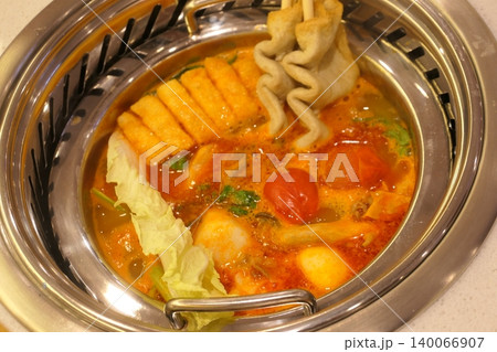 Chinese Hot Pot with Spicy Broth and Fresh Ingredients 140066907