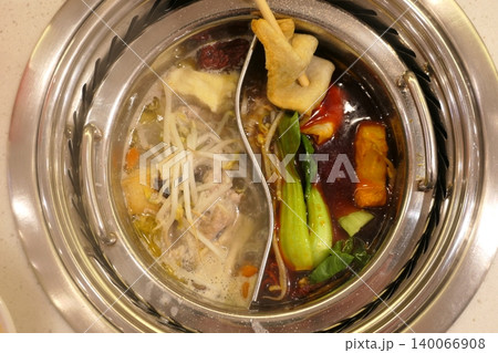 Chinese Hot Pot with Spicy Broth and Fresh Ingredients 140066908