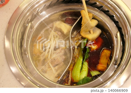 Chinese Hot Pot with Spicy Broth and Fresh Ingredients Chinese Hot Pot with Spicy Broth and Fresh Ingredients 140066909