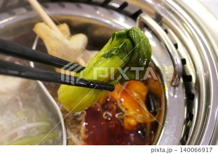 Chinese Hot Pot with Spicy Broth and Fresh Ingredients Chinese Hot Pot with Spicy Broth and Fresh Ingredients 140066917