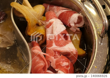 Chinese Hot Pot with Spicy Broth and Fresh Ingredients 140066926