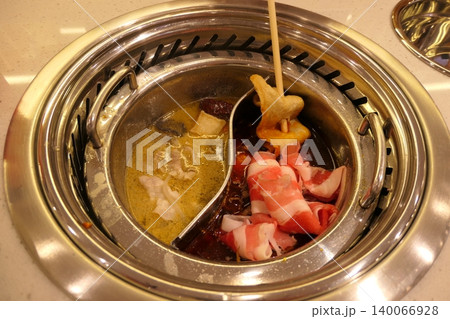 Chinese Hot Pot with Spicy Broth and Fresh Ingredients Chinese Hot Pot with Spicy Broth and Fresh Ingredients 140066928