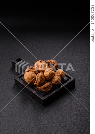 Dried whole fig as an ingredient for sweet desserts. Dried figs as a food Dried whole fig as an ingredient for sweet desserts. Dried figs as a food 140067255