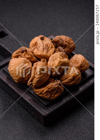 Dried whole fig as an ingredient for sweet desserts. Dried figs as a food Dried whole fig as an ingredient for sweet desserts. Dried figs as a food 140067257