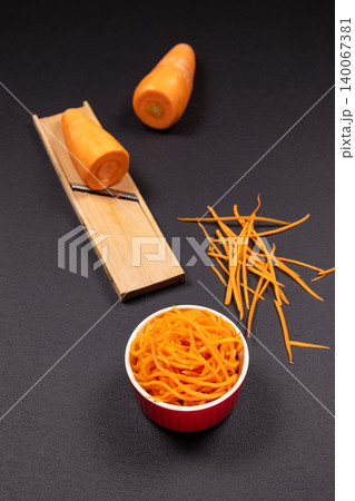 Shredding carrots for a healthy and nutritious meal 140067381