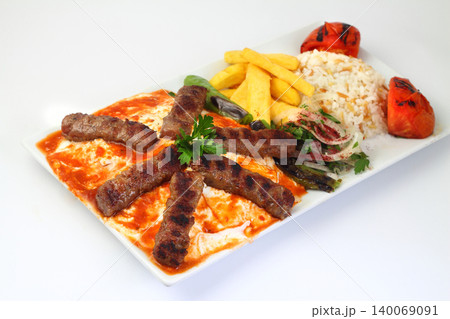 Plate of traditional grilled meatballs on white background Plate of traditional grilled meatballs on white background 140069091