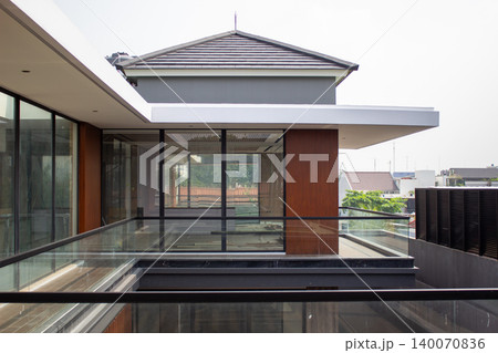Exterior view of luxury modern two-story residential house facade. 140070836