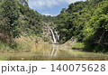 森の奥に見える滝と豊かな緑の自然風景 140075628
