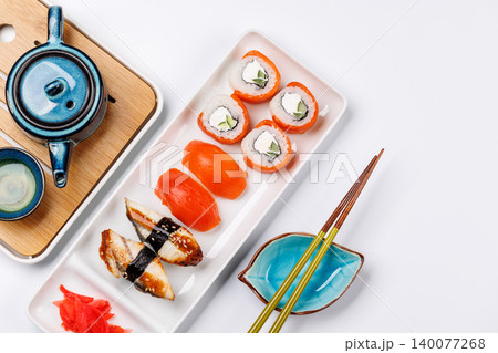 Sushi set with tea and small teapot Sushi set with tea and small teapot 140077268