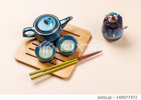 Asian tea ceremony set with teapot and cups Asian tea ceremony set with teapot and cups 140077472