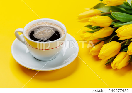 Coffee and yellow tulips Coffee and yellow tulips 140077480