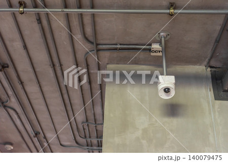 CCTV security camera mounted industrial ceiling exposed conduit pipes Surveillance system for monitoring safety protection property security CCTV security camera mounted industrial ceiling exposed conduit pipes Surveillance system for monitoring safety protection property security 140079475