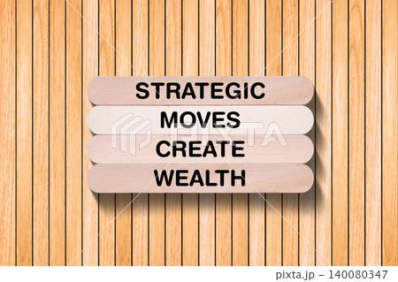 Strategic Moves Create Wealth tagline written on wooden stick with wooden texture background, business and investment, stock market theme, copy space Strategic Moves Create Wealth tagline written on wooden stick with wooden texture background, business and investment, stock market theme, copy space 140080347