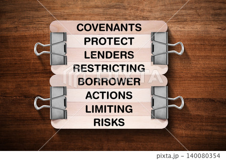 Covenants Protect Lenders Restricting Borrower Actions Limiting Risks tagline written on wooden stick hold by binder clip with wooden texture background, business and investment, stock market theme Covenants Protect Lenders Restricting Borrower Actions Limiting Risks tagline written on wooden stick hold by binder clip with wooden texture background, business and investment, stock market theme 140080354
