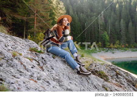 Adventure woman feeling happy among amazing mountains, forest and lake, enjoy the nature landscape 140080581