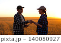 farmer makes deal to buy farmland. handshake of farmers them as a symbol of the deal of purchase and sale. purchase and sale of farmland 140080927