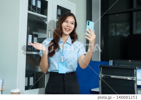 Happy businesswoman having fun social media doing live streaming using smartphone during free time. Happy businesswoman having fun social media doing live streaming using smartphone during free time. 140081251