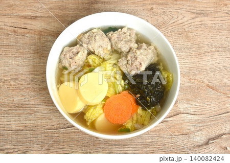 boiled egg tofu with mashed pork and seaweed couple cabbage topping carrot soup on bowl boiled egg tofu with mashed pork and seaweed couple cabbage topping carrot soup on bowl 140082424