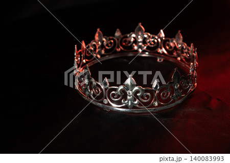 Golden crown with sparkling gemstones on red glitter background, luxury glamour celebration concept. Golden crown with sparkling gemstones on red glitter background, luxury glamour celebration concept. 140083993