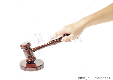 Hand holding a wooden gavel in White Background. Isolated Background. Justice and Law Concept. Judge, Legal and Authority Symbol. High quality photo Hand holding a wooden gavel in White Background. Isolated Background. Justice and Law Concept. Judge, Legal and Authority Symbol. High quality photo 140085374