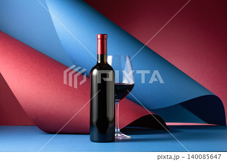 Bottle and glass of red wine. Bottle and glass of red wine. 140085647