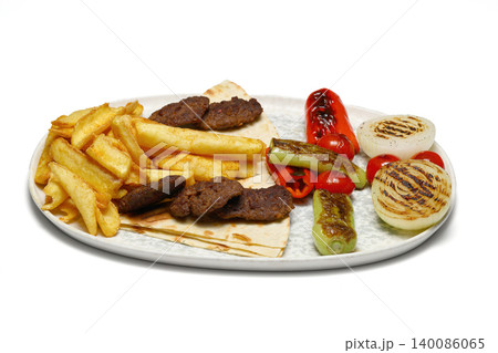 Plate of traditional grilled meatballs on white background Plate of traditional grilled meatballs on white background 140086065