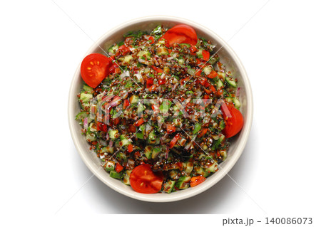 Healthy mixed salad in white bowl on wooden table. Mediterranean salad Healthy mixed salad in white bowl on wooden table. Mediterranean salad 140086073
