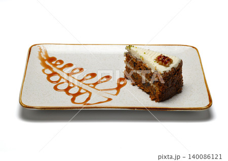 piece of cake on a plate. isolated on white background. piece of cake on a plate. isolated on white background. 140086121