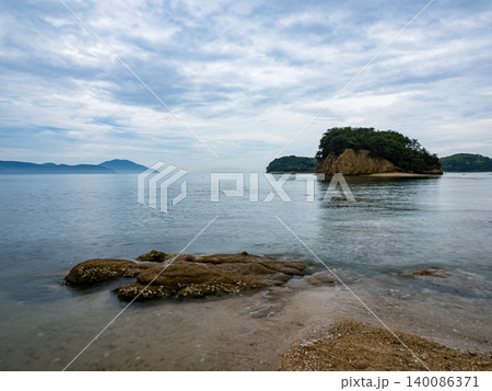 Misty panoramic landscape of Shodoshima Island with Seto Inland Sea, mountain ridges and drifting clouds. 140086371
