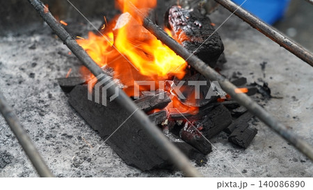 Fiery Charcoal Embers Heating Up for a Delicious BBQ Fiery Charcoal Embers Heating Up for a Delicious BBQ 140086890